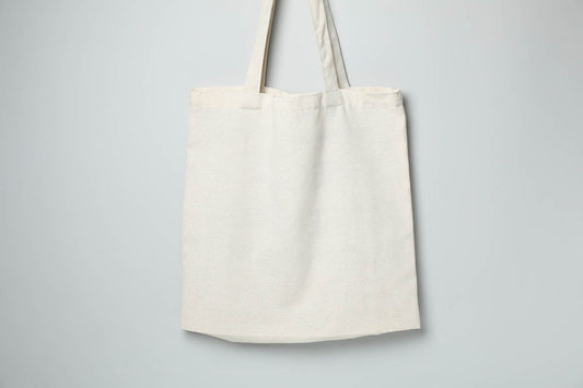 Blank natural cotton tote bag showing the fabric weight and drape of a mid-range g/m² canvas