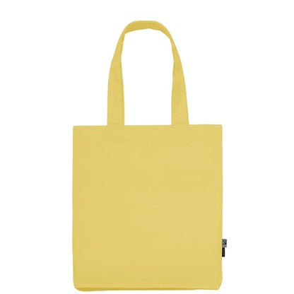 Pölyinen keltainen Fairtrade-luomutwill-kangaskassi logopainatuksella
