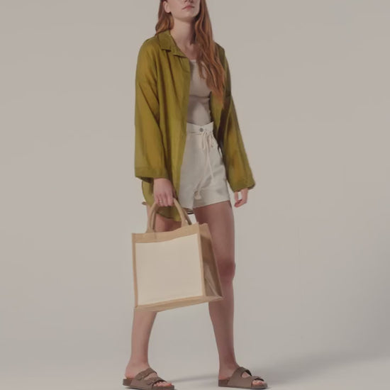 Video of the Natural Cotton Pocket Jute Midi Tote, 30 x 30 x 19 cm, showing the laminated jute body and cotton front pocket for custom logo printing